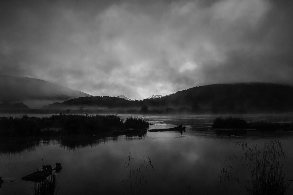 a lake with trees and mountains in the background, lapataia tierra del fuego 2013